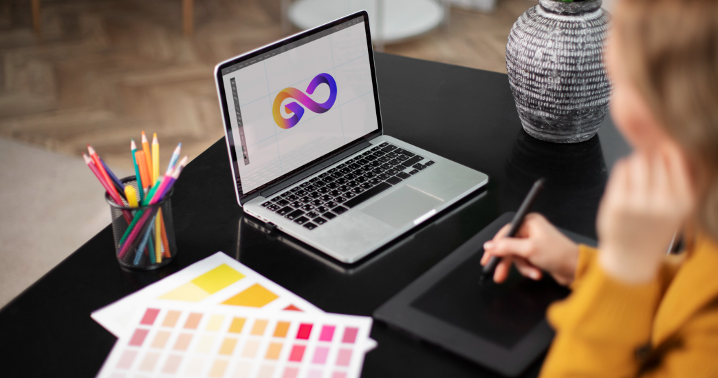 A graphic designer working on a laptop