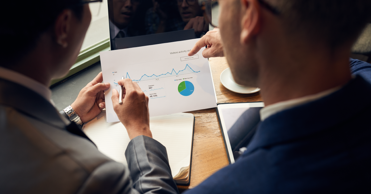 Digital marketing experts reviewing website traffic statistics and performance metrics