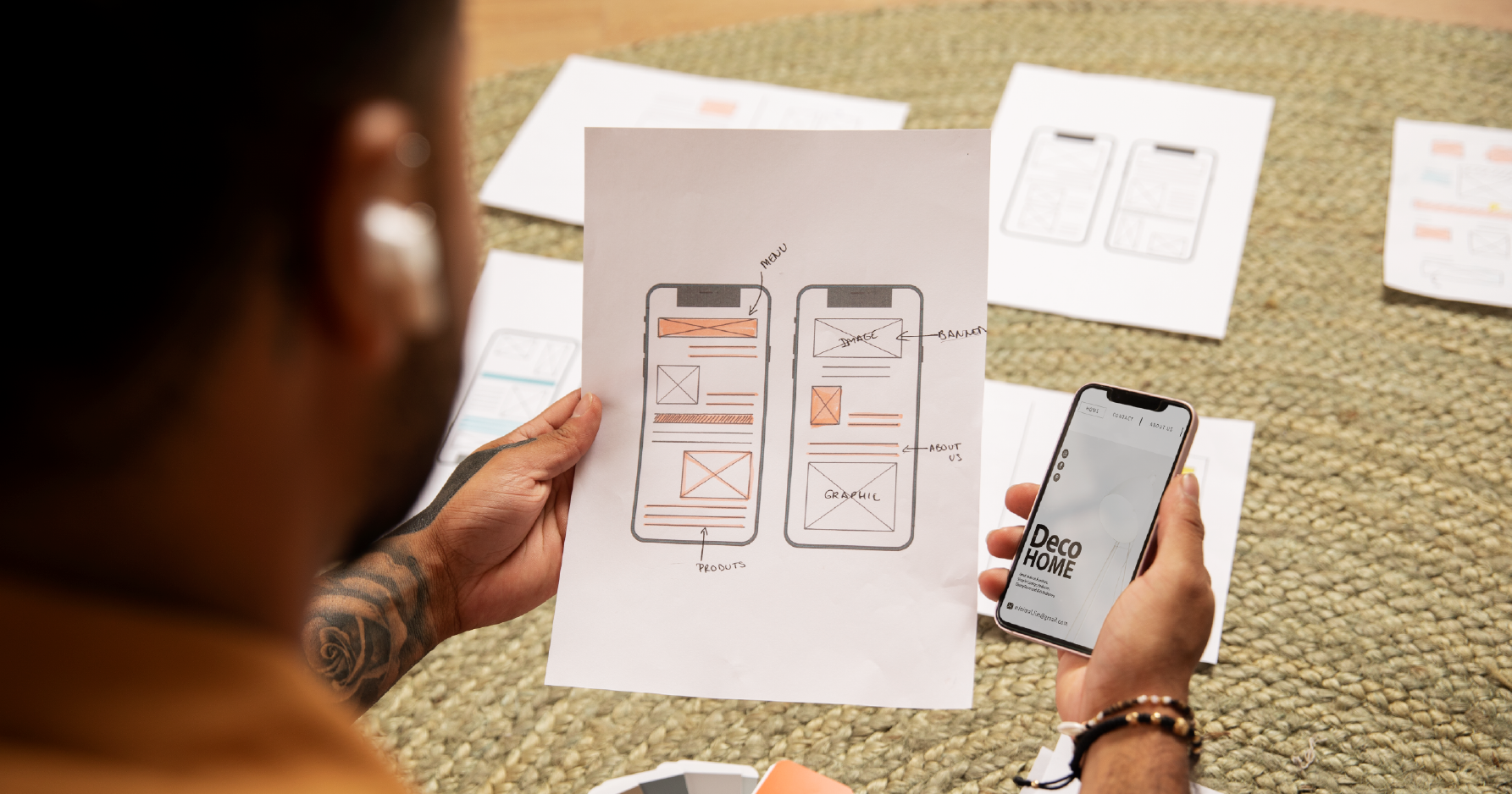 a person looking at wireframes